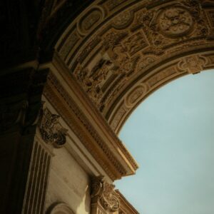 Ornate architectural archway with detailed carvings against sky