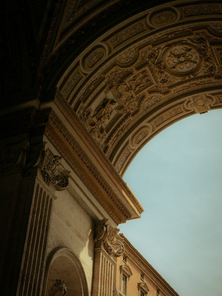 Ornate architectural archway with detailed carvings against sky